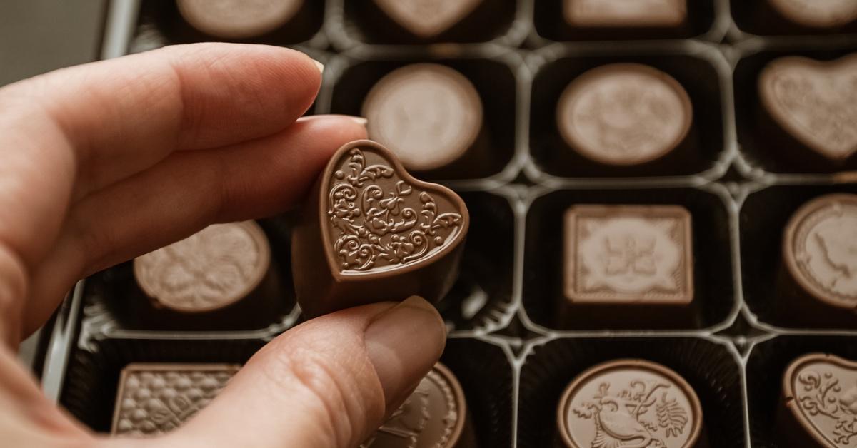 Person holding box of chocolates