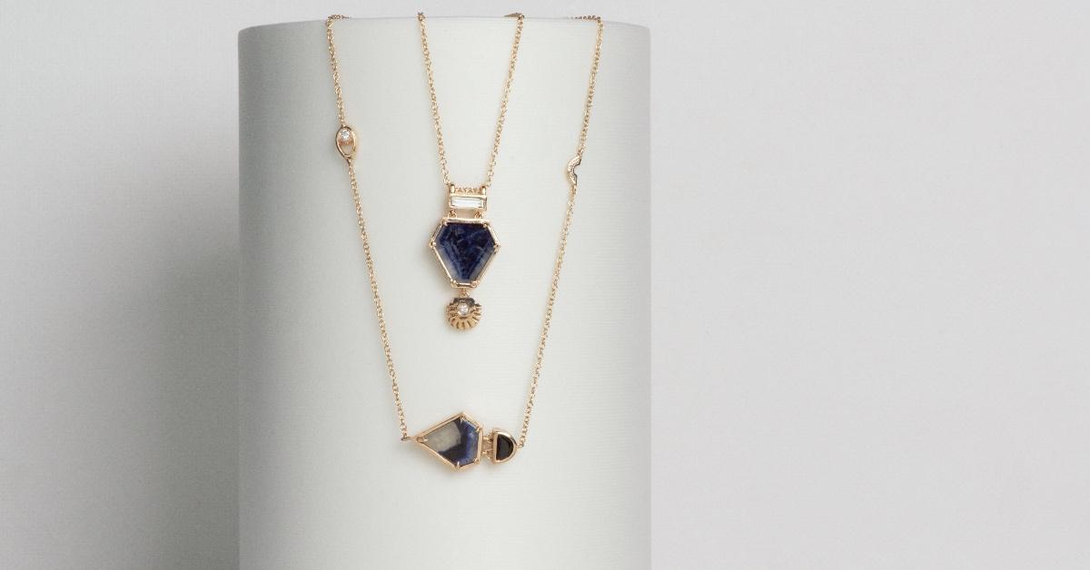 Photograph of blue and gold necklaces.
