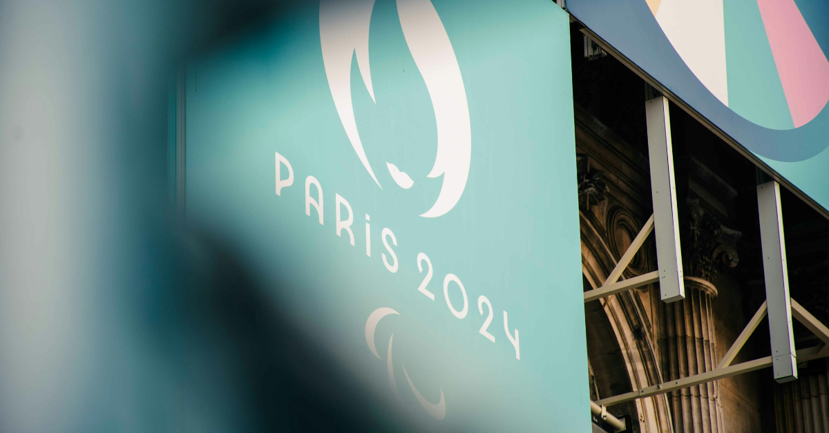 A Paris 2024 logo is visible between some decorations for the Paris Olympics