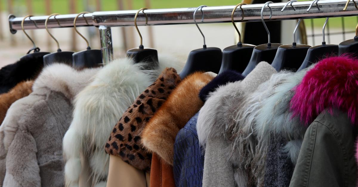 Vintage fur coats on the rack in a secondhand store.