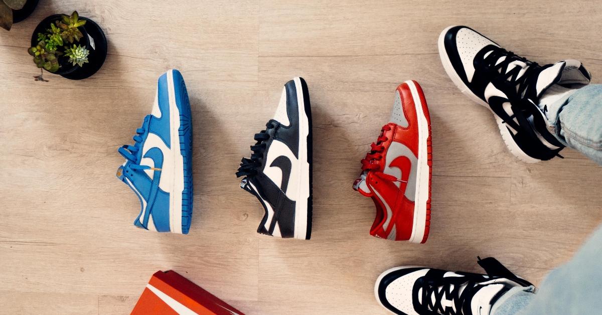 A lineup of Nike sneakers on a wood floor